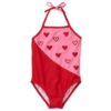 Traje de baño enterizo para niña color rosa y rojo con diseño de corazones disponible en Rosy Badia.