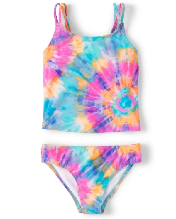 Tankini para niña con estampado tie dye multicolor y tirantes cruzados disponible en Rosy Badia.