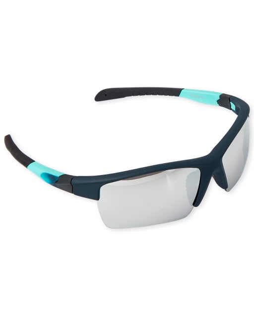 Lentes de sol deportivos infantiles azul petróleo con detalles turquesa y protección UV disponibles en Rosy Badia.