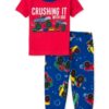 Pijama infantil para niño con camiseta roja Monster Truck y pantalón largo azul estampado con camiones monstruo.