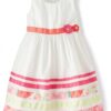 vestido blanco floral para niña con cinturón rosa