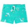 Short infantil turquesa para niña con estampado de delfines y arcoíris.