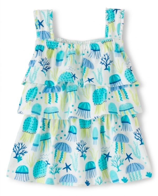 blusa blanca de niña con medusas y volantes