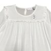 blusa blanca manga larga con volantes para niña