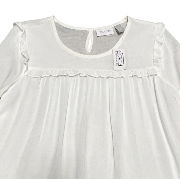 blusa blanca manga larga con volantes para niña