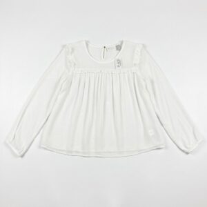 blusa blanca manga larga con volantes para niña